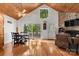 Bright living room featuring wood floors, vaulted ceilings and a stone fireplace at 360 Lake Landing Dr, Salisbury, NC 28146