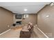Comfortable living room featuring a cozy fireplace and a plush leather sofa at 360 Lake Landing Dr, Salisbury, NC 28146