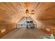 Spacious loft area with wood-paneled walls, perfect as an office or additional living space at 360 Lake Landing Dr, Salisbury, NC 28146