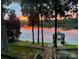 Waterfront views with the dock illuminated by the sunset at 360 Lake Landing Dr, Salisbury, NC 28146