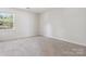 Cozy bedroom with carpet, one window, base molding, and outlets at 411 Carlisle Dr, Indian Trail, NC 28079