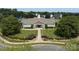 Community clubhouse with manicured landscaping, a clock tower and covered entrance creating a welcoming gathering space at 411 Carlisle Dr, Indian Trail, NC 28079