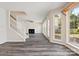 Inviting living space with staircase, fireplace and large windows offering view of outdoors at 411 Carlisle Dr, Indian Trail, NC 28079