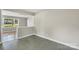 Open dining room with neutral walls and tile floors, perfect for entertaining at 4413 Tillman Rd, Charlotte, NC 28208