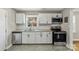 Modern kitchen with stainless steel appliances, granite countertops, and white subway tile backsplash at 4413 Tillman Rd, Charlotte, NC 28208