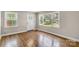 Bright living room with natural light and hardwood floors throughout at 4413 Tillman Rd, Charlotte, NC 28208