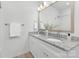 Modern bathroom with double sinks, granite countertop, and large mirror at 4472 Pebblebrook Sw Cir, Concord, NC 28027
