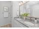 Updated bathroom featuring dual sinks, granite countertop, and elegant fixtures at 4472 Pebblebrook Sw Cir, Concord, NC 28027