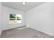 This bedroom is a blank canvas ready for its new owners' personal touches at 4472 Pebblebrook Sw Cir, Concord, NC 28027