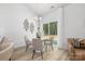 Cozy dining area with modern decor and a sliding glass door to the backyard at 4472 Pebblebrook Sw Cir, Concord, NC 28027