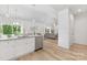 Open-concept living space with hardwood floors and lots of natural light at 4472 Pebblebrook Sw Cir, Concord, NC 28027