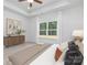 Inviting main bedroom featuring a large window and lots of natural light at 4472 Pebblebrook Sw Cir, Concord, NC 28027