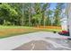Backyard with patio, grass, and mature trees perfect for outdoor entertaining at 473 Wendover Dr, Salisbury, NC 28147