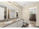 Bright bathroom with dual sinks, granite countertop, white cabinets, and a shower/tub combo at 473 Wendover Dr, Salisbury, NC 28147