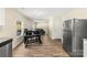 Open-concept kitchen featuring stainless steel appliances and a view into the adjacent living room at 473 Wendover Dr, Salisbury, NC 28147