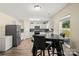 Bright kitchen with stainless steel appliances, white cabinets, and a cozy eat-in dining area at 473 Wendover Dr, Salisbury, NC 28147