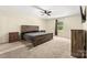 Spacious bedroom featuring carpet, wood furniture, neutral walls, a ceiling fan, and natural light at 473 Wendover Dr, Salisbury, NC 28147