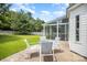 Outdoor patio with dining furniture and a sunroom visible in the background at 4835 Chesney Nw St, Concord, NC 28027