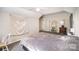 Cozy bedroom with neutral walls, ceiling fan, and carpeted floor at 4835 Chesney Nw St, Concord, NC 28027