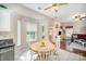 Cozy breakfast nook with a wood table, white chairs and natural light at 4835 Chesney Nw St, Concord, NC 28027