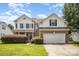 Charming two-story home with a well-manicured lawn, brick accents and a two car garage at 4835 Chesney Nw St, Concord, NC 28027