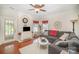 Comfortable living room with hardwood floors, ceiling fan, and plenty of natural light at 4835 Chesney Nw St, Concord, NC 28027