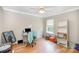 Home office with laminate flooring, a large window, and ample storage space at 4835 Chesney Nw St, Concord, NC 28027