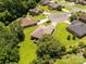 An aerial view features a backyard with a patio area, a lush lawn, and mature trees providing privacy at 511 Birmingham Ct, Rock Hill, SC 29732