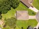 An aerial view shows a house with a well-maintained roof, backyard, and a driveway leading to the street at 511 Birmingham Ct, Rock Hill, SC 29732