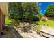 Inviting outdoor deck with a dining table, seating, and a tranquil view of the green backyard at 511 Birmingham Ct, Rock Hill, SC 29732
