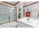 Bright bathroom with white vanity and gold-framed shower with sliding glass doors at 511 Birmingham Ct, Rock Hill, SC 29732