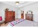 Spacious bedroom boasts matching wooden dressers and closet with double doors at 511 Birmingham Ct, Rock Hill, SC 29732