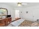 Cozy bedroom features a wooden dresser with mirror and a ceiling fan at 511 Birmingham Ct, Rock Hill, SC 29732