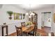 Formal dining room with hardwood floors, chandelier, and decorative mirror at 511 Birmingham Ct, Rock Hill, SC 29732