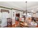 Bright dining area with chandelier, access to living room, and a glass table at 511 Birmingham Ct, Rock Hill, SC 29732