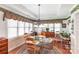 Elegant dining room with tray ceiling, round glass table, and ample natural light at 511 Birmingham Ct, Rock Hill, SC 29732