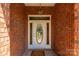 Elegant front entrance featuring a decorative glass door, brick walls, and a hanging light fixture at 511 Birmingham Ct, Rock Hill, SC 29732