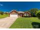 A charming single-story red brick home with a two-car garage and well-maintained landscaping at 511 Birmingham Ct, Rock Hill, SC 29732