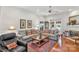 Bright living room with a fireplace, hardwood floors, comfortable seating, and lots of natural light at 511 Birmingham Ct, Rock Hill, SC 29732
