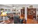 Cozy living room featuring a fireplace, hardwood floors, and built-in bookshelves at 511 Birmingham Ct, Rock Hill, SC 29732