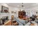 Bright living room featuring a fireplace, hardwood floors, and comfortable gray furniture at 511 Birmingham Ct, Rock Hill, SC 29732