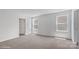 Bright bedroom featuring neutral carpet, natural light, and a walk-in closet at 514 13Th Avenue Ne Dr, Hickory, NC 28601