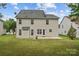 View of a two story house with an expansive backyard and patio, perfect for outdoor entertaining at 516 Cool Creek Dr, Rock Hill, SC 29732