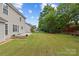 Well-maintained backyard featuring a spacious lawn and mature trees at 516 Cool Creek Dr, Rock Hill, SC 29732