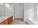 Bathroom featuring a double sink vanity, tub and shower at 516 Cool Creek Dr, Rock Hill, SC 29732