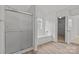 Bright bathroom featuring a glass shower, bathtub, and access to a walk-in closet at 516 Cool Creek Dr, Rock Hill, SC 29732