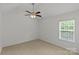 Bedroom with neutral carpet, vaulted ceiling, ceiling fan, and a window letting in natural light at 516 Cool Creek Dr, Rock Hill, SC 29732