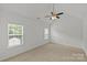 Bright bedroom with neutral carpet, vaulted ceiling, and a ceiling fan at 516 Cool Creek Dr, Rock Hill, SC 29732