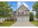 Charming two-story home with a two-car garage and well-maintained front lawn at 516 Cool Creek Dr, Rock Hill, SC 29732