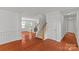 Inviting foyer with hardwood floors, staircase, and views into the living room at 516 Cool Creek Dr, Rock Hill, SC 29732